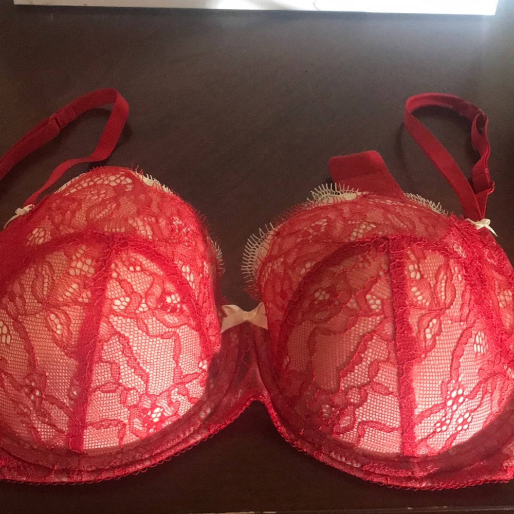 Sex red lace bra. Never worn. Cream background.
